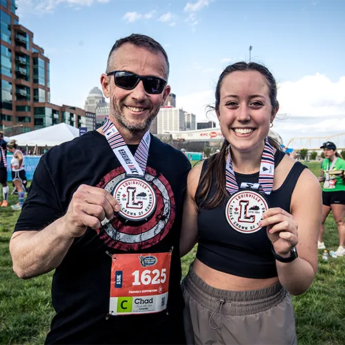 dad and daughter post race medals dad and daughter post race medals
