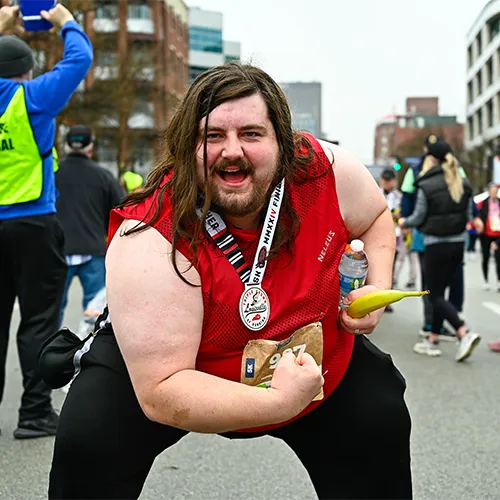 man with medal showing off muscles man with medal showing off muscles