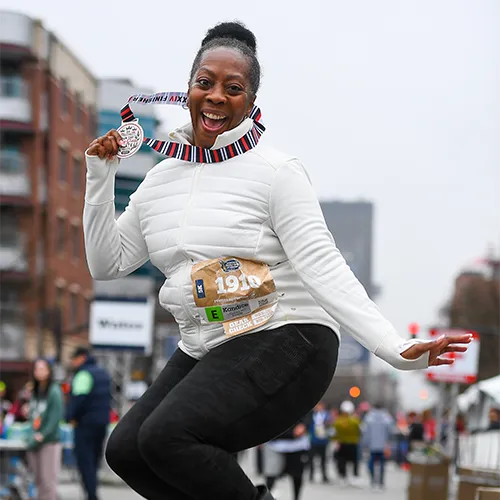 excited 5k finisher with medal excited 5k finisher with medal