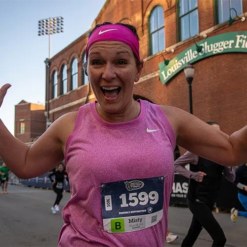 woman in all pink near Louisville Slugger Field woman in all pink near Louisville Slugger Field